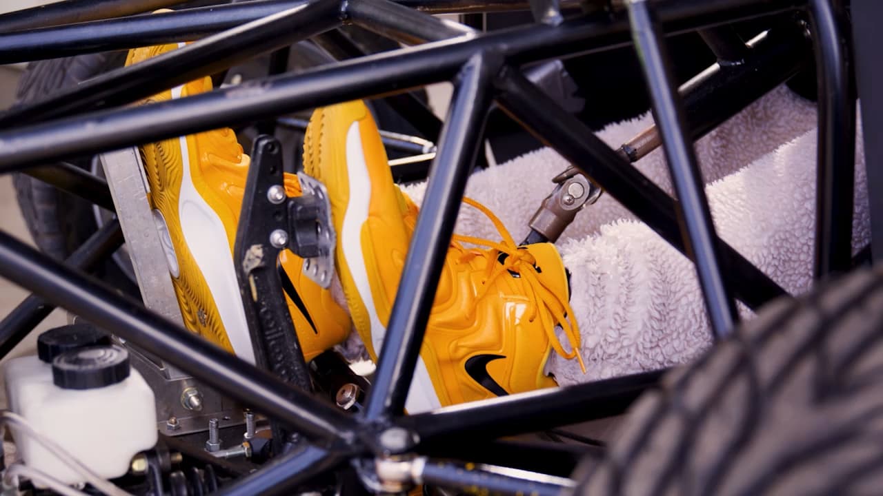 Close-up of Rodney the Ram&rsquo;s VCU-themed sneakers inside the roll cage of VCU's Race Team Formula SAE car