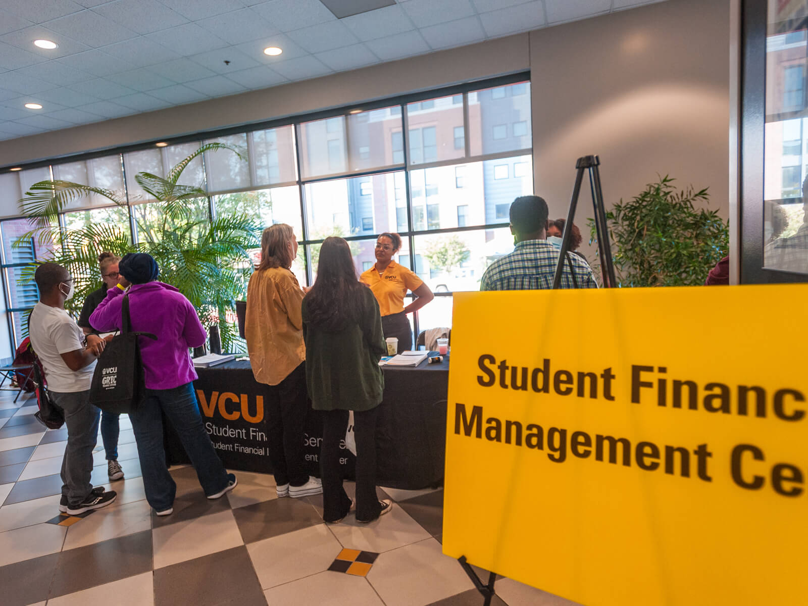 Photo of people talking with VCU Student Financial Managment