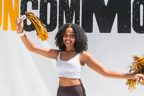 VCU student with pom-poms