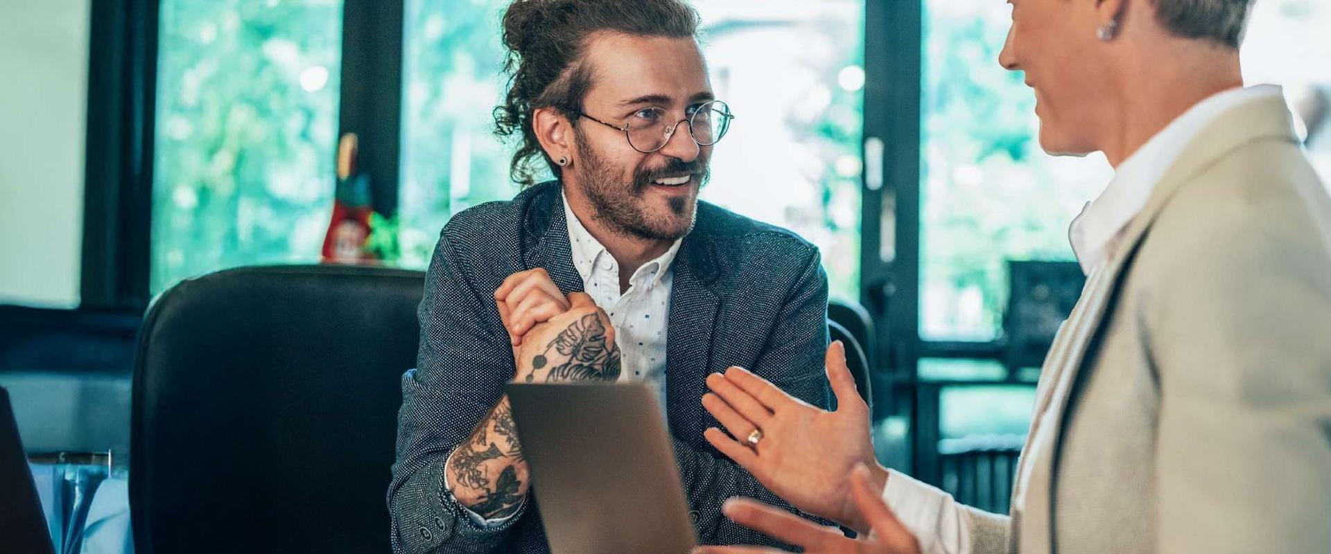 A manager having a conversation with a business colleague