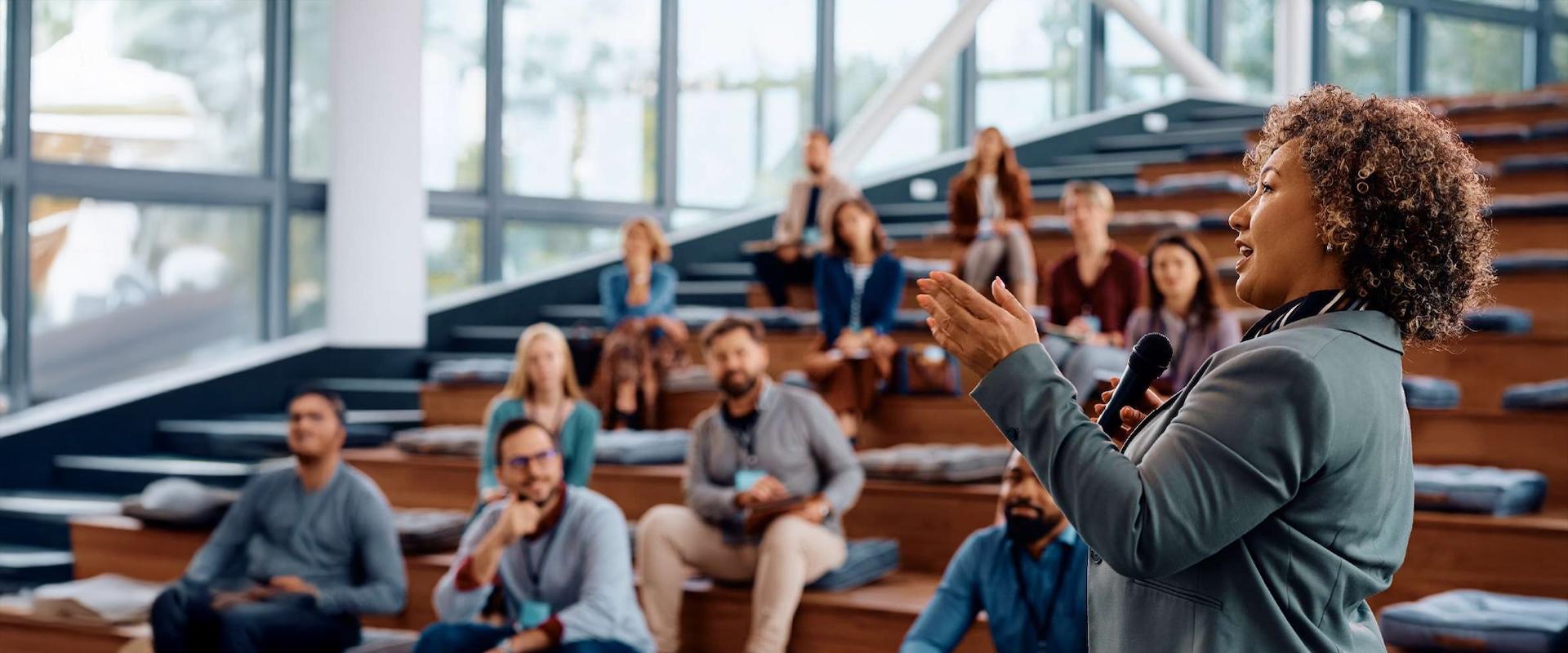 Community-based leader gives empowering speech to a group