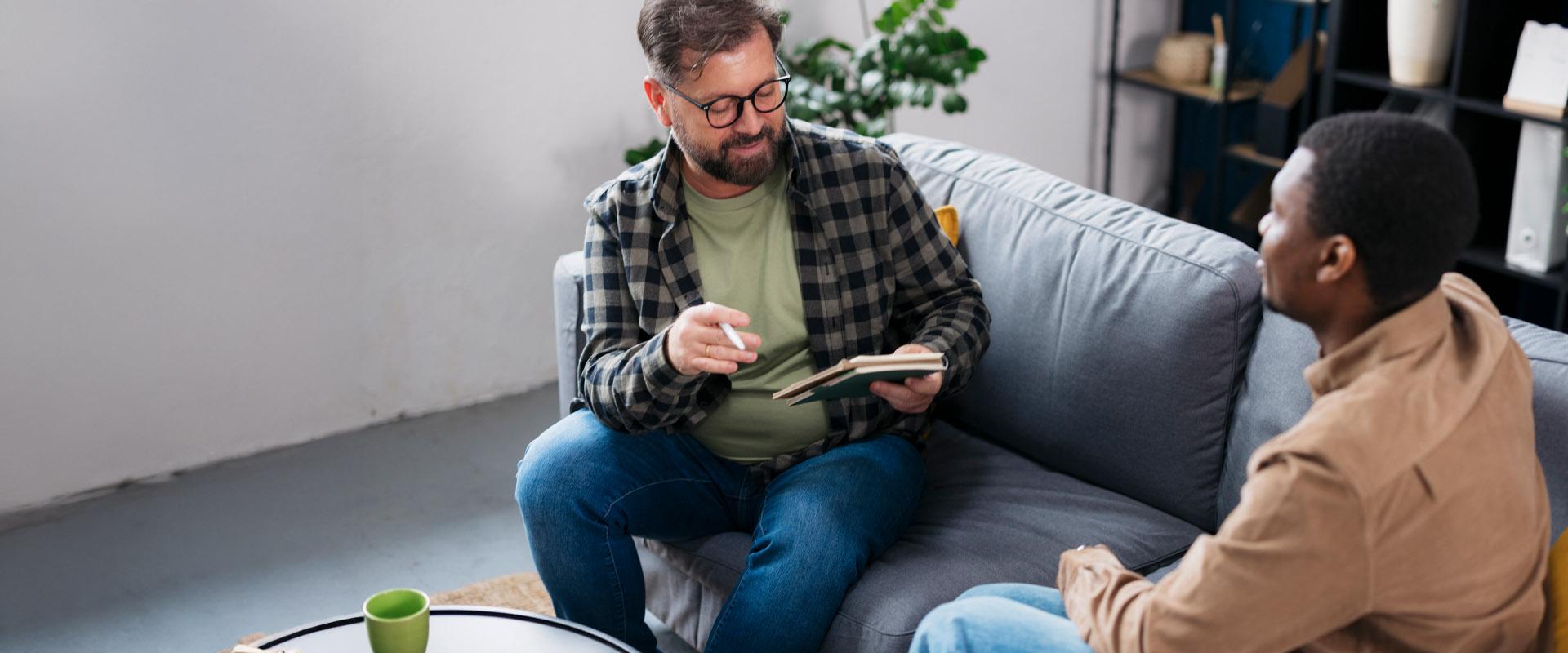 A client looking motivated while meeting with a health behavior coach