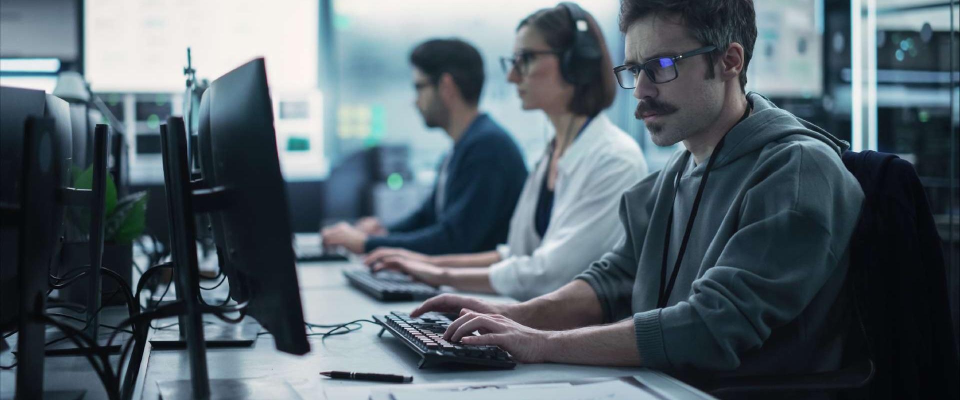 Team of homeland security professionals answering phones at a call center