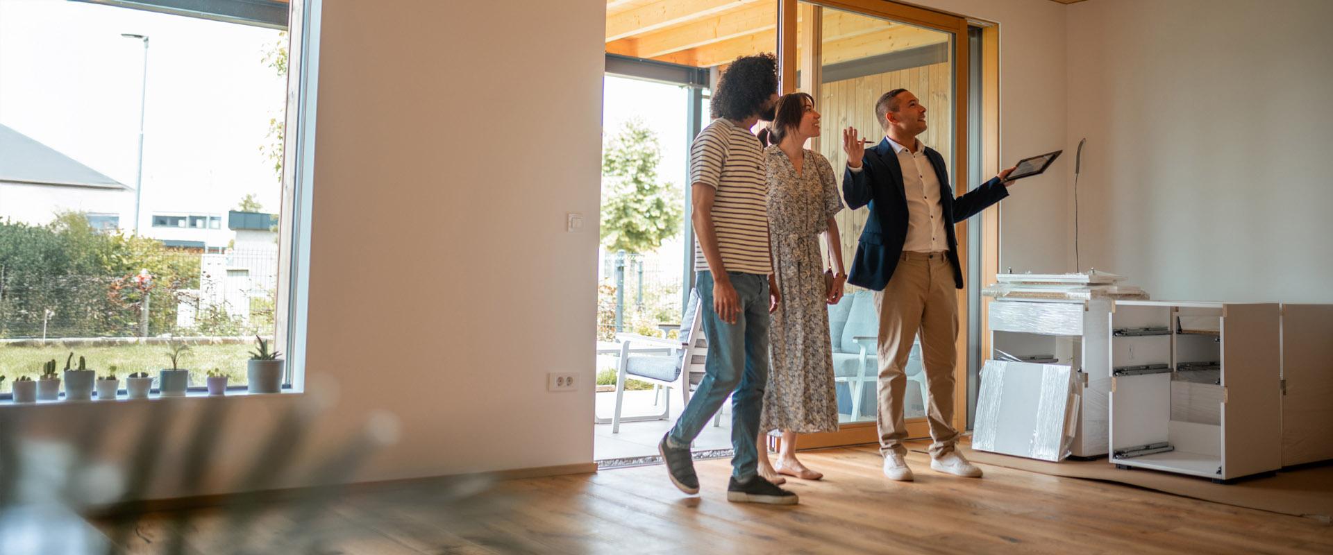 A real estate owner showing property to prospective buyers