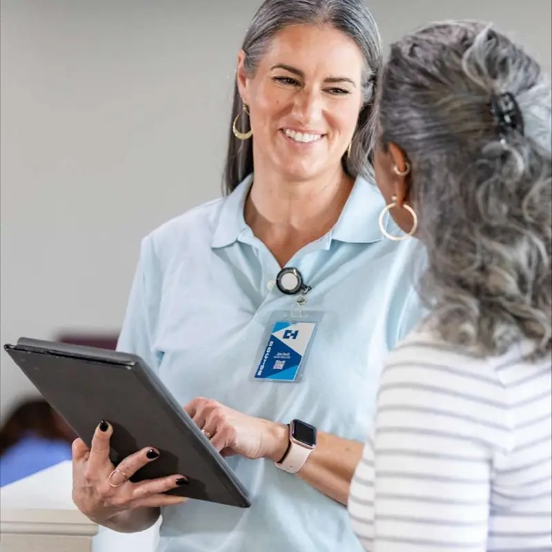 A care coordinator meeting an individual to discuss health care needs