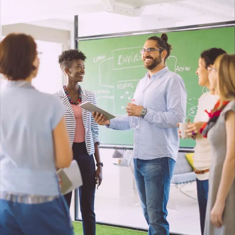 A group of transformative leaders who are in a group discussion