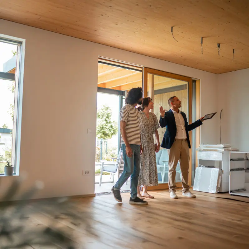 A real estate owner showing property to prospective buyers